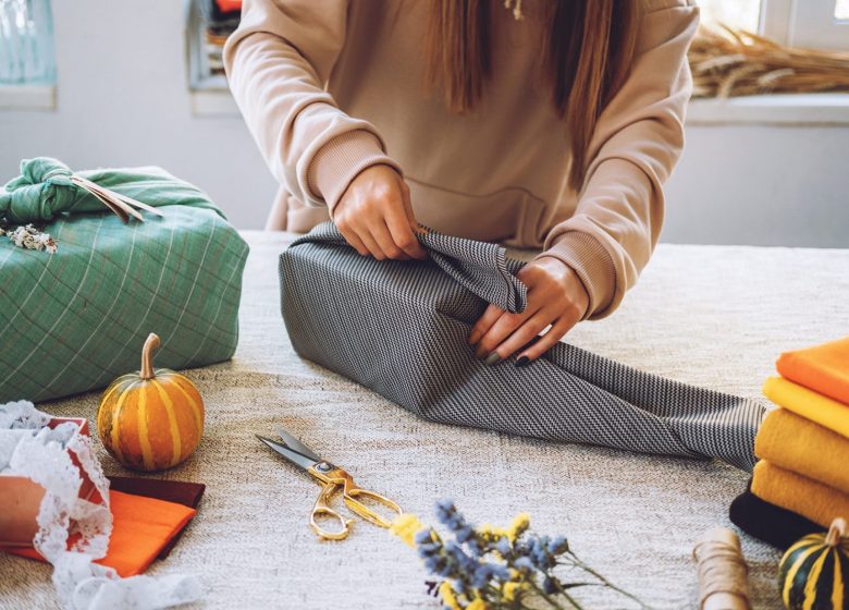 Furoshiki Japanese Gift Wrapping. Thanksgiving Zero waste, eco-friendly gift wrapping process, tutorial. Fall hand-wrapped gift in traditional Japanese Furoshiki style