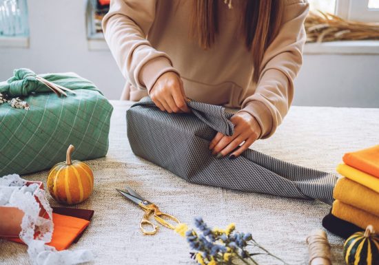 Furoshiki Japanese Gift Wrapping. Thanksgiving Zero waste, eco-friendly gift wrapping process, tutorial. Fall hand-wrapped gift in traditional Japanese Furoshiki style
